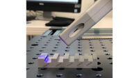 PSL metrology head measuring a chamfer on a machined chamfer and radius standard.