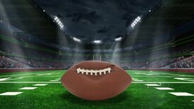 Unraveling Deflategate: Football stadium with closeup of football on field