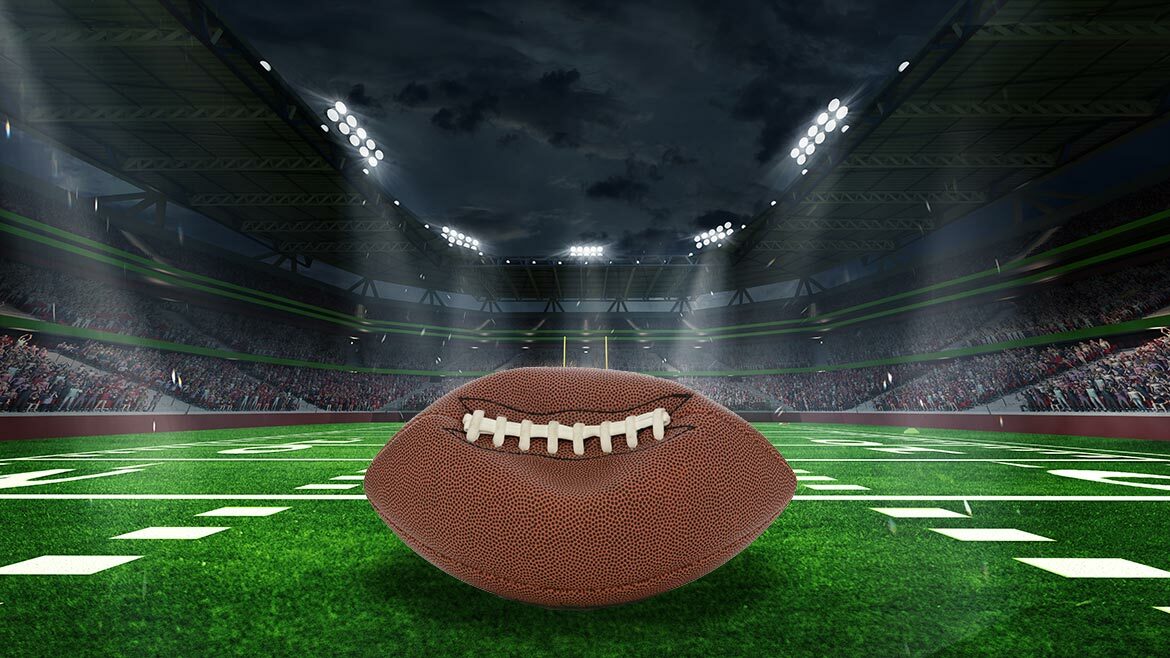 Unraveling Deflategate: Football stadium with closeup of football on field