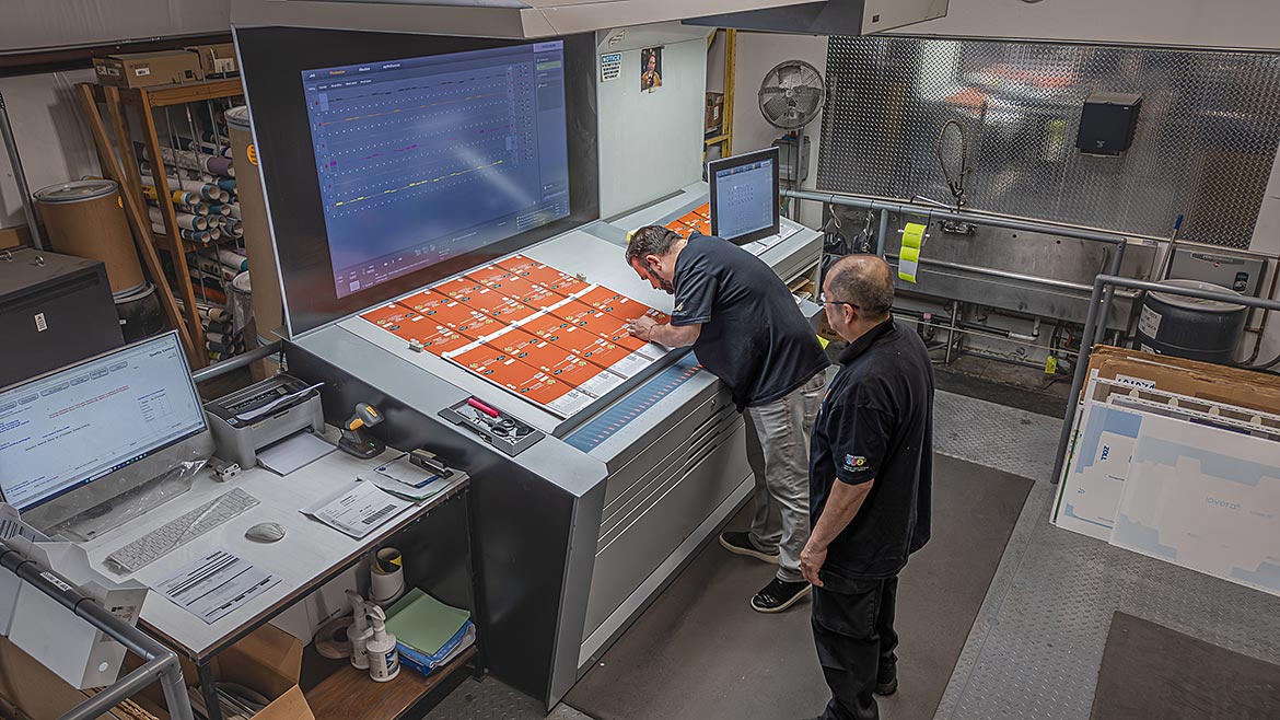 Employees shown working at Spectrum Custom Packaging.