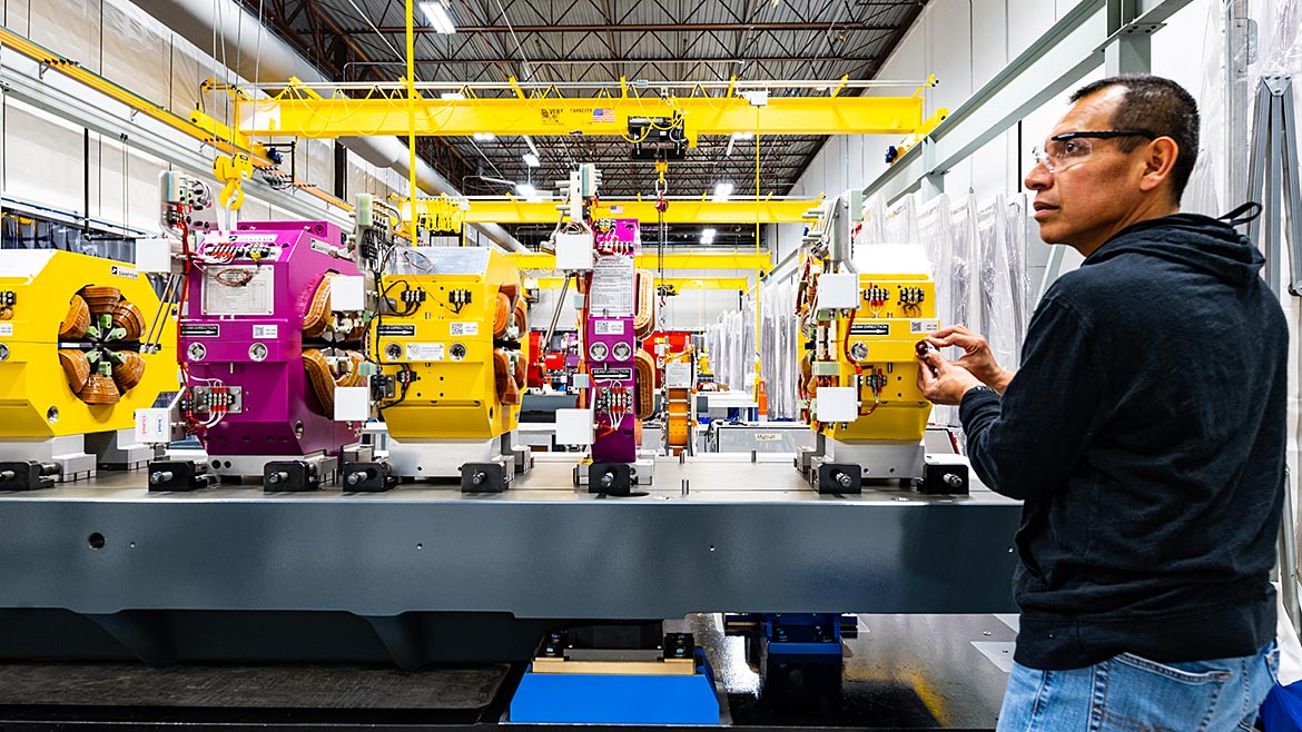 Technician surveying a module of the new APS electron storage ring in the assembly area of Building 981.