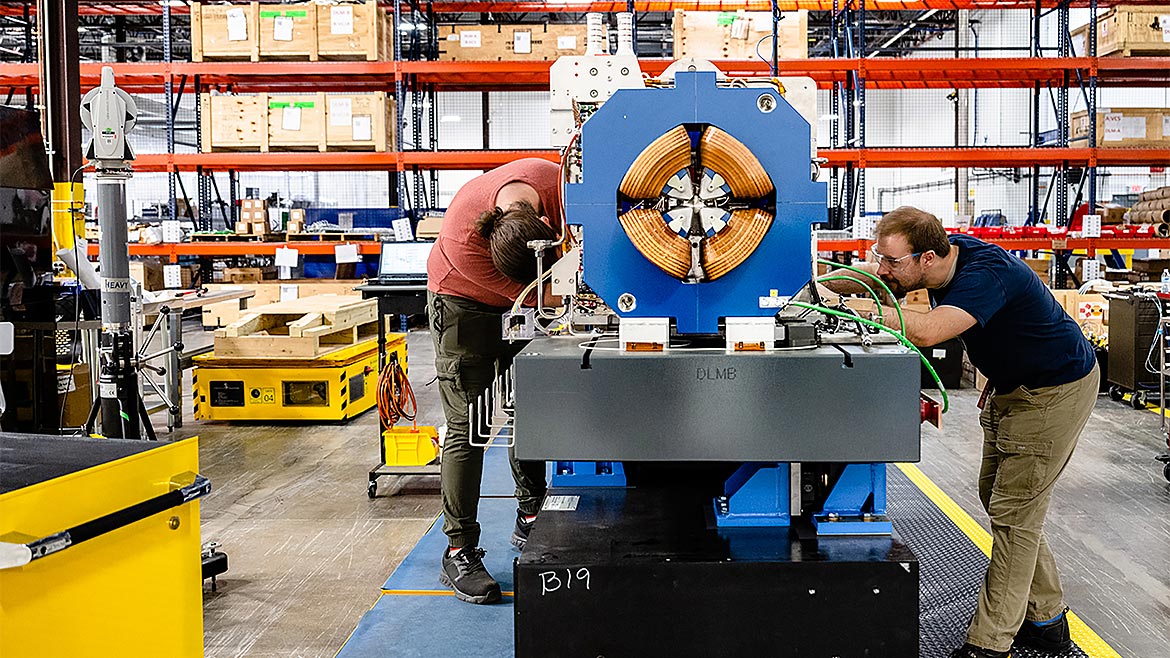 APS Survey & Alignment technicians performing work on a storage ring module assembly in Building 981.