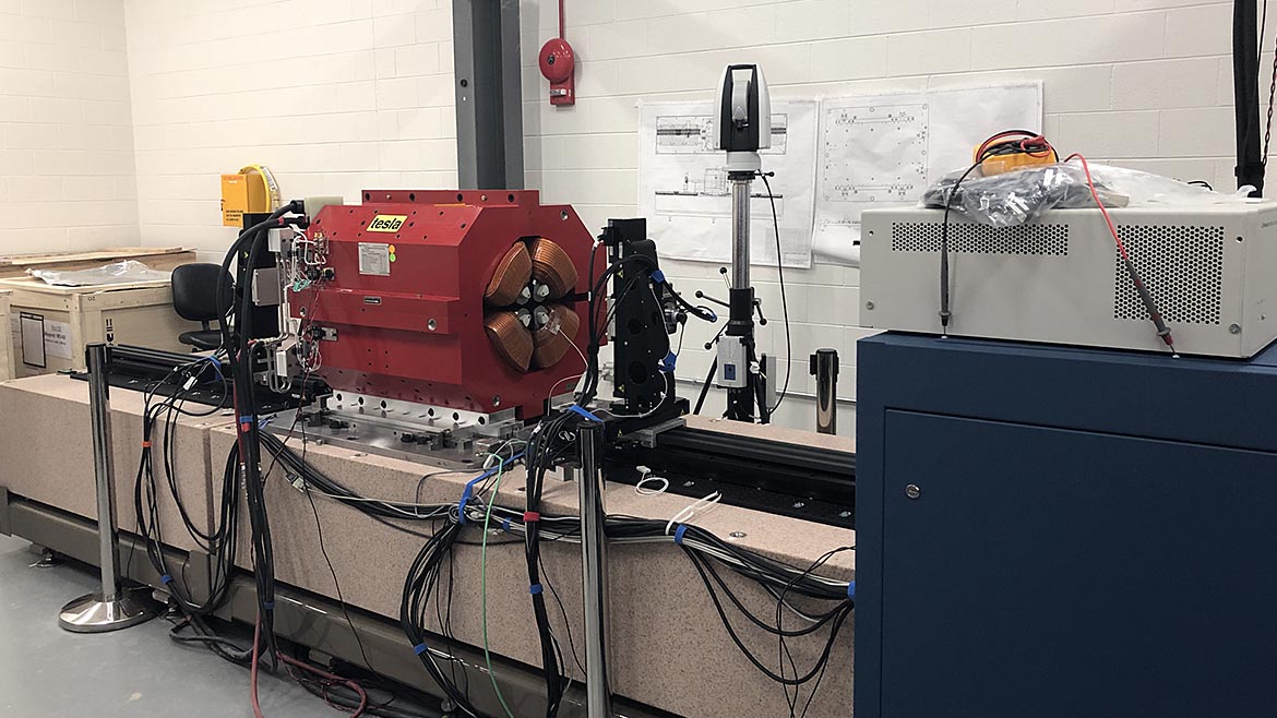 Rotating wire magnet measurement bench with a quadrupole magnet set up for fiducialization.