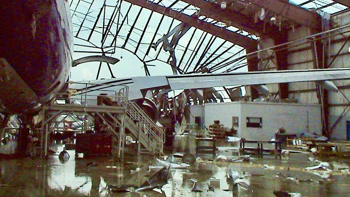 Damaged aircraft in destroyed hangar at Baton Rouge, LA following Hurricane Rita.