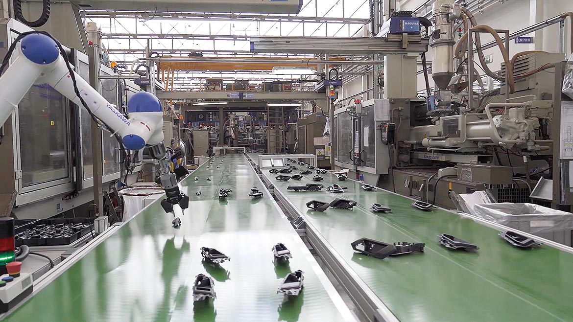 Automated robotic arms as part of the assembly line.