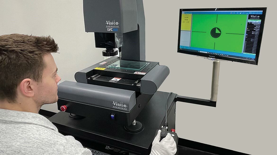 Technician working with the Vision Engineering LVC200.