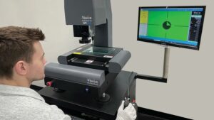 Technician working with the Vision Engineering LVC200.