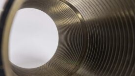 Close-up of circle tube with spiral inside, tunnel of spiral