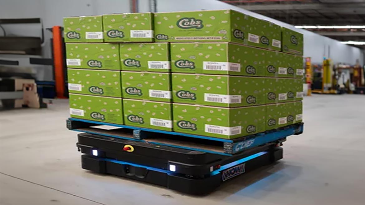 An MiR1350 autonomous mobile robot moving boxes at Cobs Popcorn in Australia.