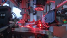 Close up of machine part measuring production line in factory.